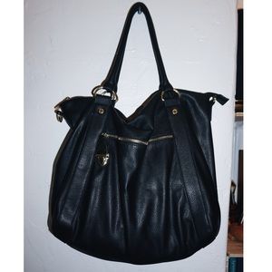 Black faux leather Steve Madden bag.